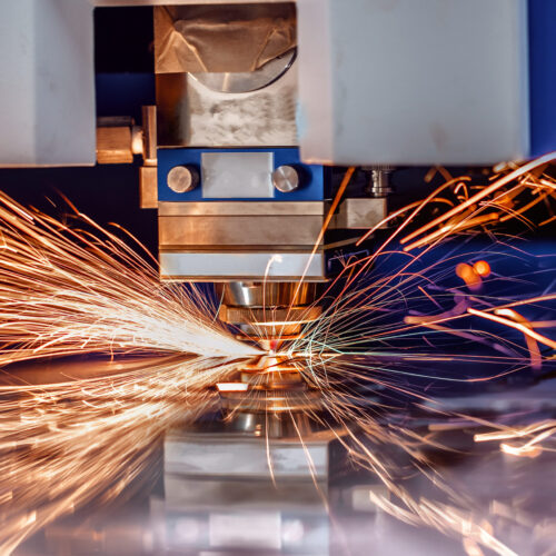 CNC Laser cutting of metal modern industrial technology. Laser cutting works by directing the output of a high-power laser through optics. Laser optics and CNC computer numerical control.