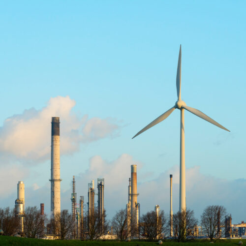 Wind turbine in front of oil refinery, Rotterdam, Zuid-Holland, The Netherlands